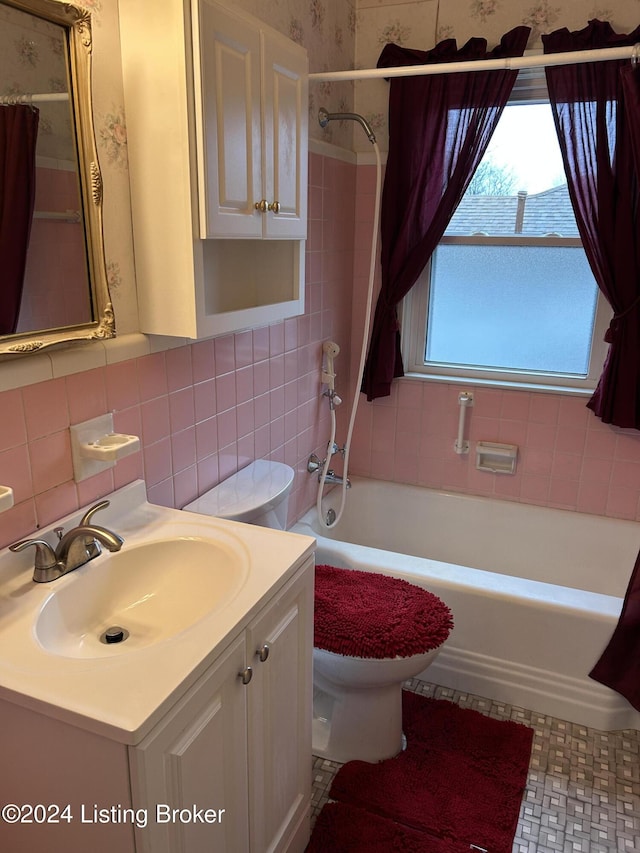 full bathroom featuring backsplash, shower / bath combination with curtain, toilet, vanity, and tile walls