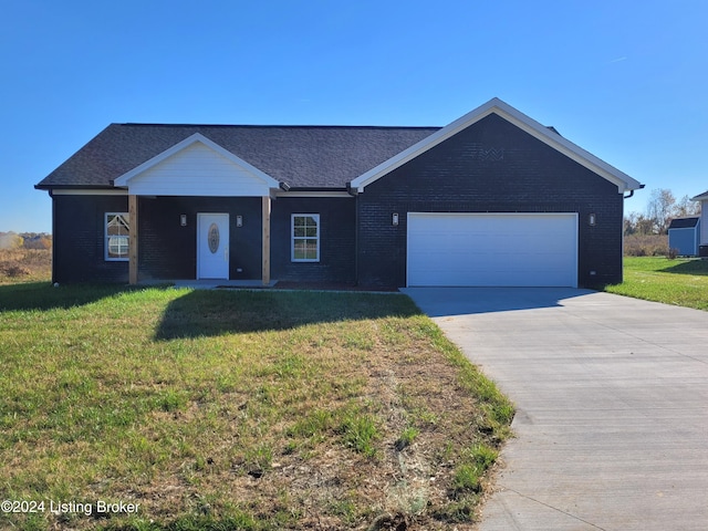 ranch-style home featuring a garage and a front yard