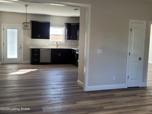 kitchen with dark hardwood / wood-style floors, pendant lighting, dishwasher, sink, and stove