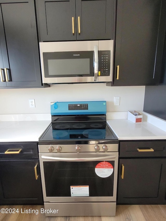 kitchen featuring appliances with stainless steel finishes and light wood-type flooring