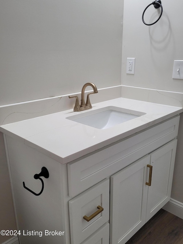 bathroom with vanity and wood-type flooring