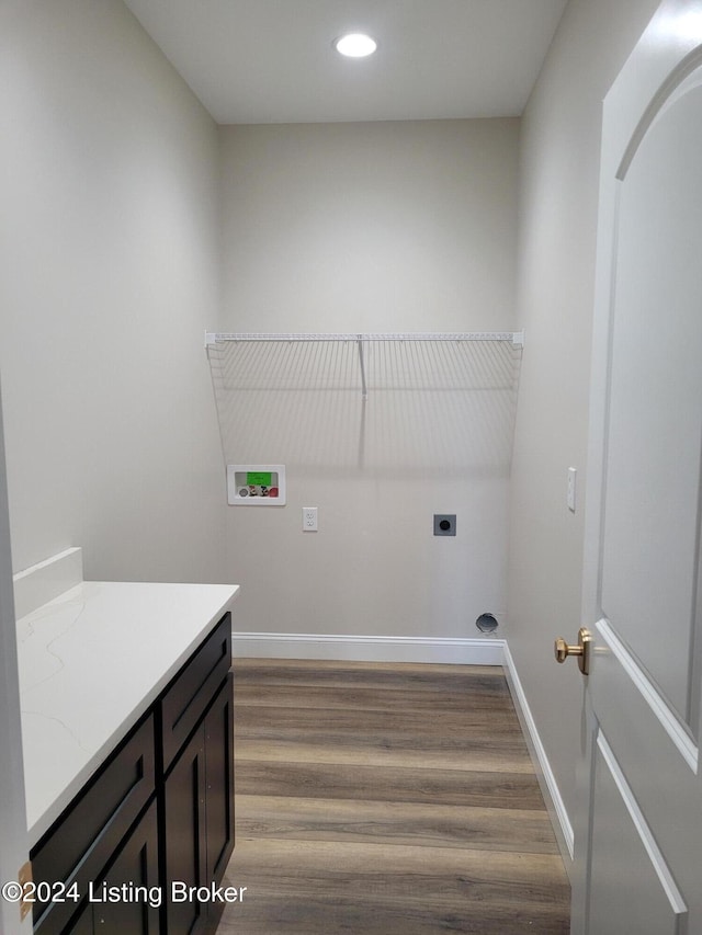 washroom with washer hookup, hardwood / wood-style flooring, and hookup for an electric dryer