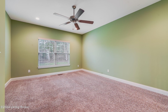 empty room with carpet floors and ceiling fan