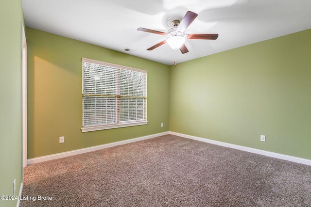 carpeted empty room with ceiling fan