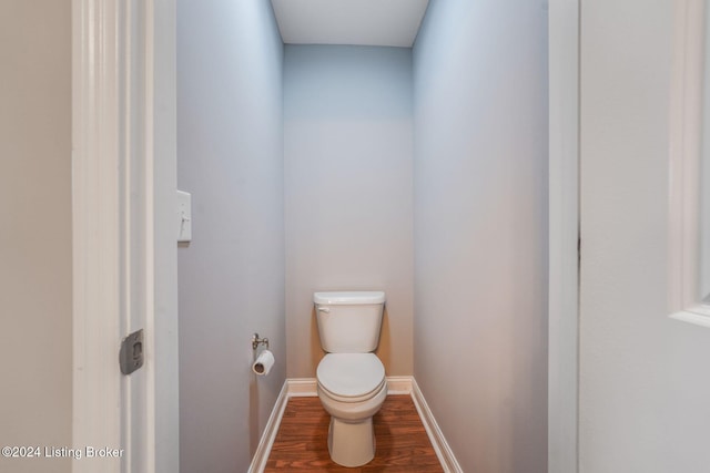 bathroom featuring hardwood / wood-style floors and toilet