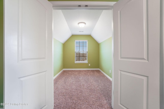 bonus room featuring carpet flooring and lofted ceiling