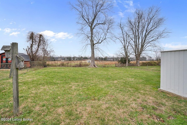 view of yard with a rural view