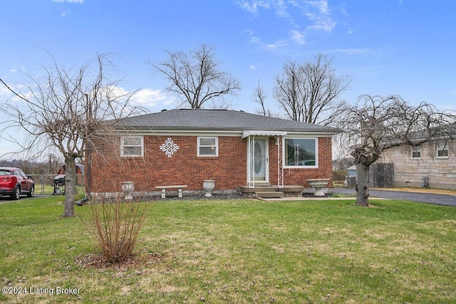 view of front of property with a front lawn