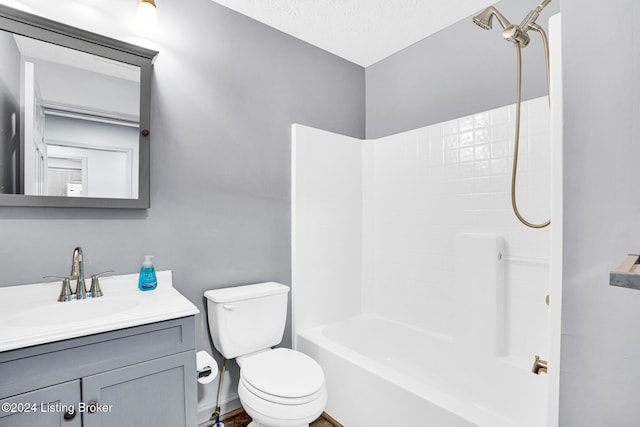 full bathroom featuring vanity, shower / bathtub combination, toilet, and a textured ceiling