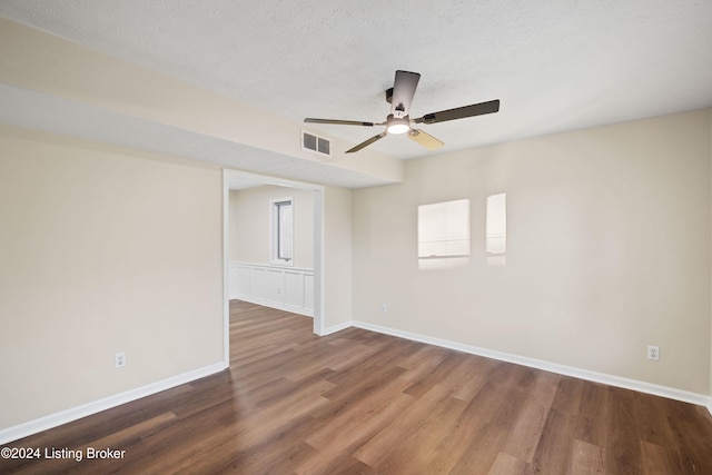 spare room featuring hardwood / wood-style floors, a textured ceiling, and ceiling fan