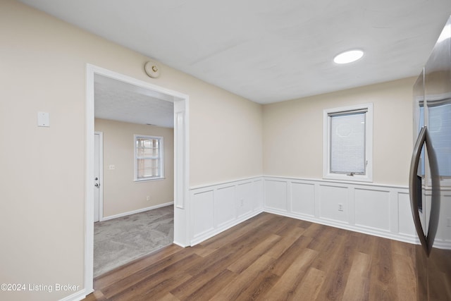 empty room with dark wood-type flooring