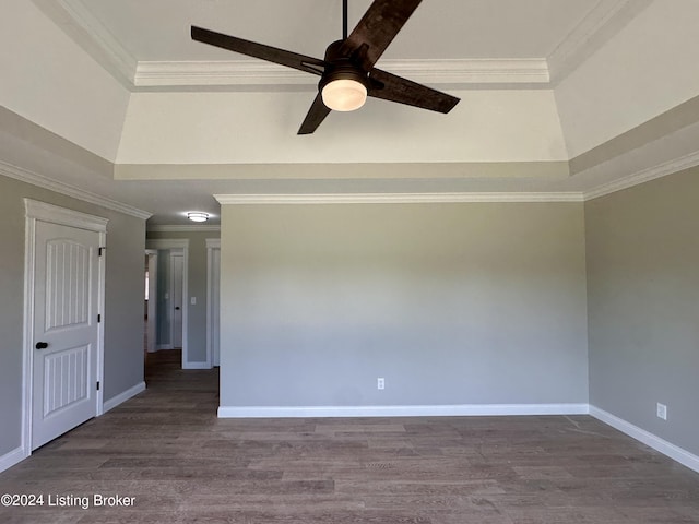 spare room featuring crown molding, ceiling fan, and wood-type flooring