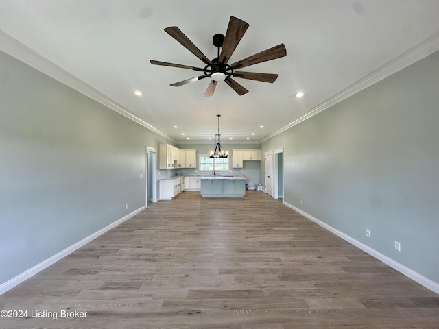 unfurnished living room with light hardwood / wood-style flooring, ceiling fan, and ornamental molding