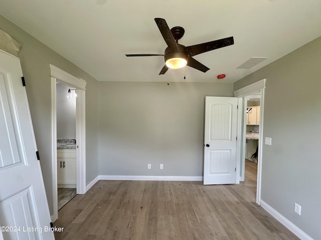 unfurnished room with ceiling fan and light hardwood / wood-style flooring