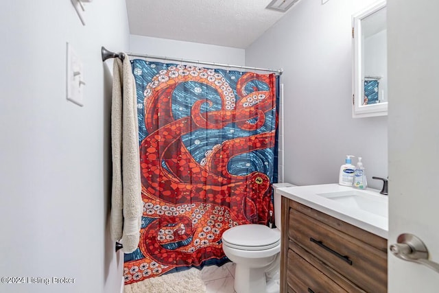 bathroom featuring vanity, tile patterned floors, a shower with curtain, toilet, and a textured ceiling