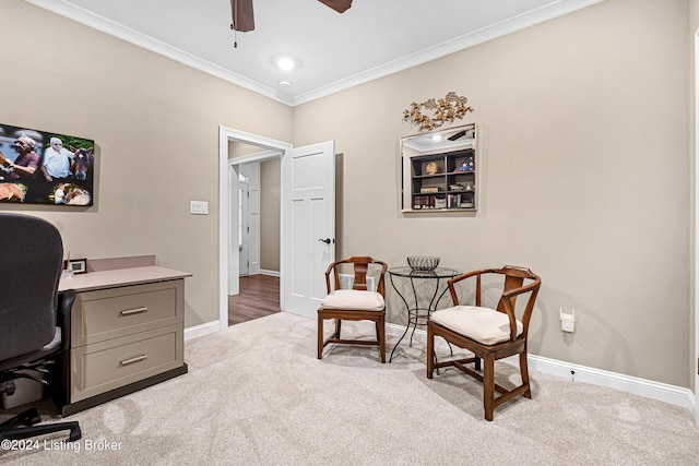 office featuring light carpet, ceiling fan, and crown molding