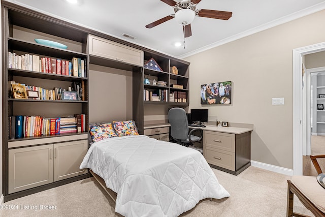 carpeted bedroom featuring ceiling fan and crown molding