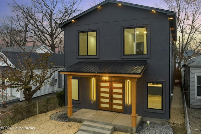 modern home featuring a porch