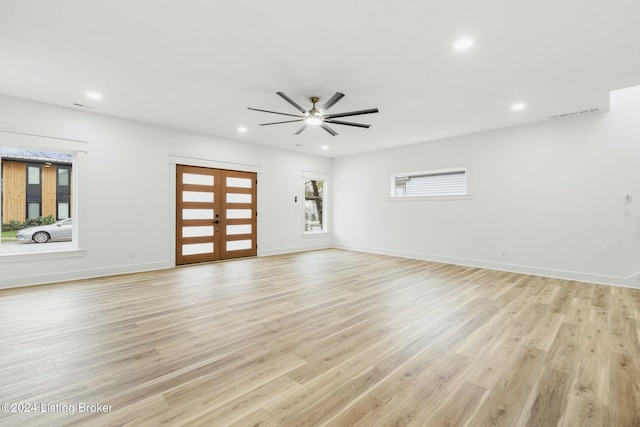 unfurnished room with ceiling fan and light hardwood / wood-style floors