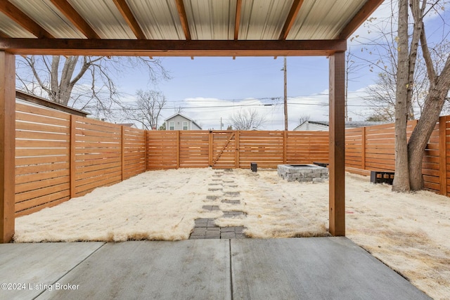 view of patio with an outdoor fire pit