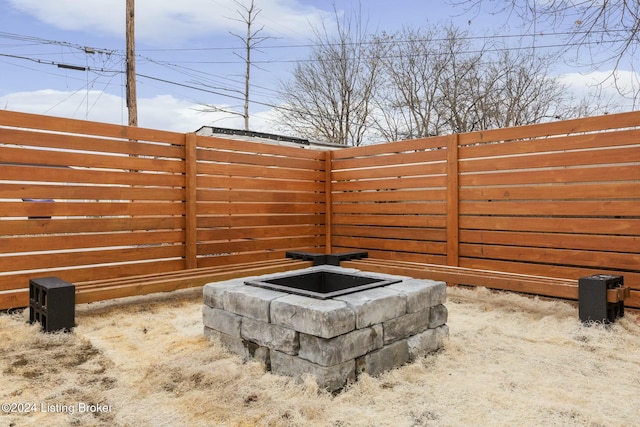 exterior space featuring an outdoor fire pit