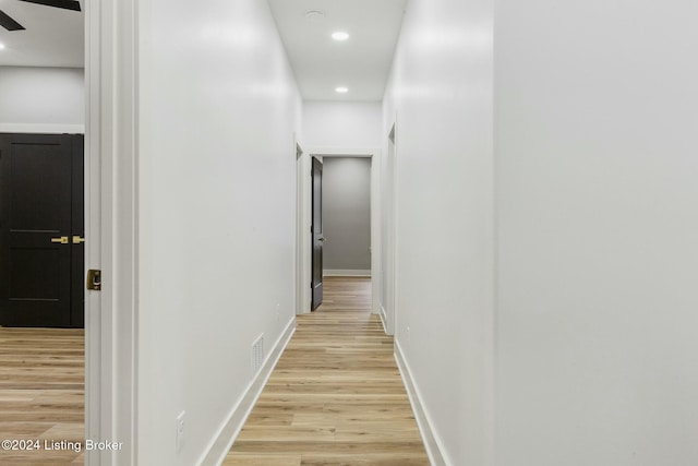 hallway with light wood-type flooring