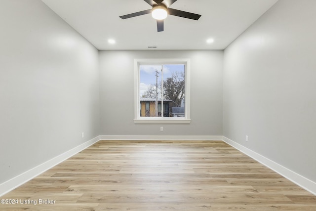 unfurnished room with ceiling fan and light hardwood / wood-style floors