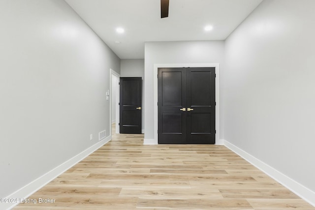 interior space featuring light hardwood / wood-style flooring and ceiling fan