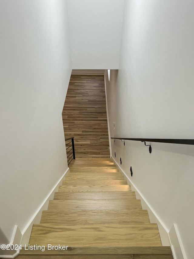 stairway featuring hardwood / wood-style flooring