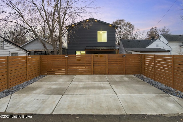 view of patio terrace at dusk