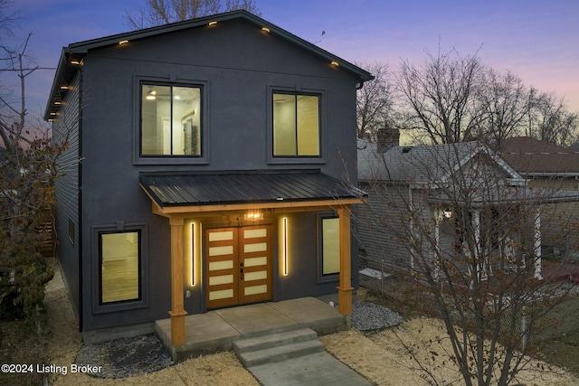 contemporary home featuring a porch