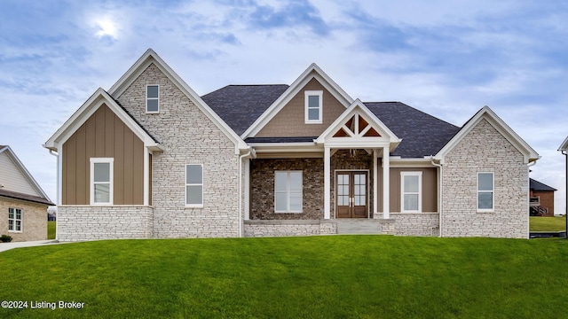 view of front of house featuring french doors and a front lawn