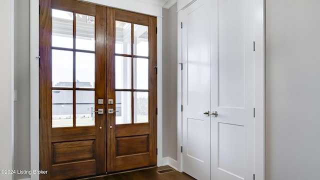 doorway to outside with french doors, dark hardwood / wood-style floors, and a wealth of natural light