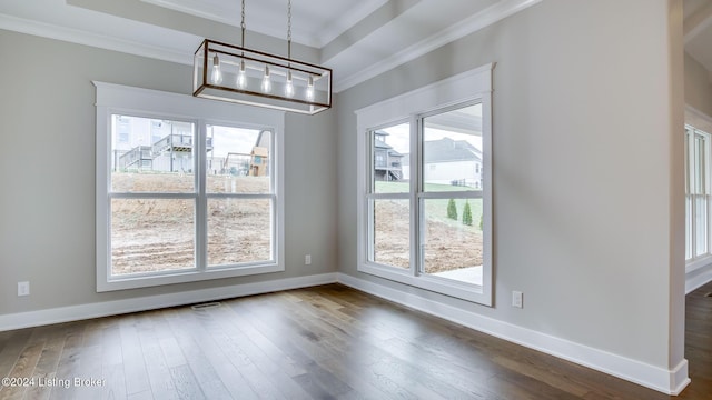 unfurnished dining area featuring a wealth of natural light, dark hardwood / wood-style flooring, and ornamental molding