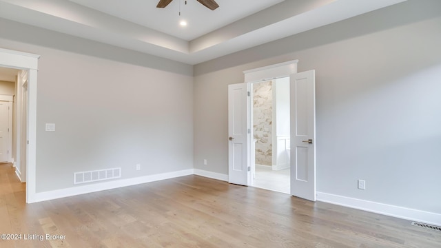 spare room featuring ceiling fan and light wood-type flooring