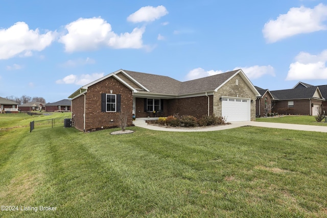 single story home with cooling unit, a front lawn, and a garage