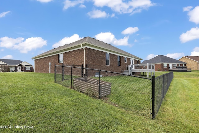 view of property exterior featuring a yard and a deck