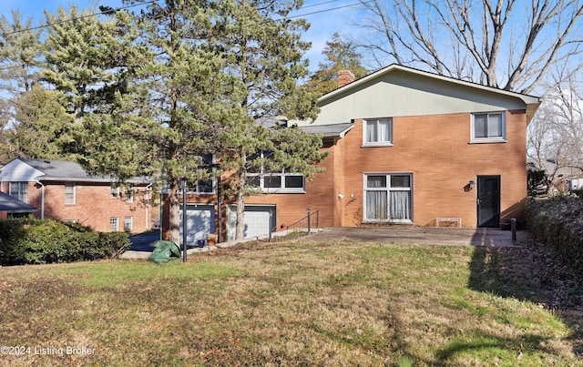 back of house featuring a yard