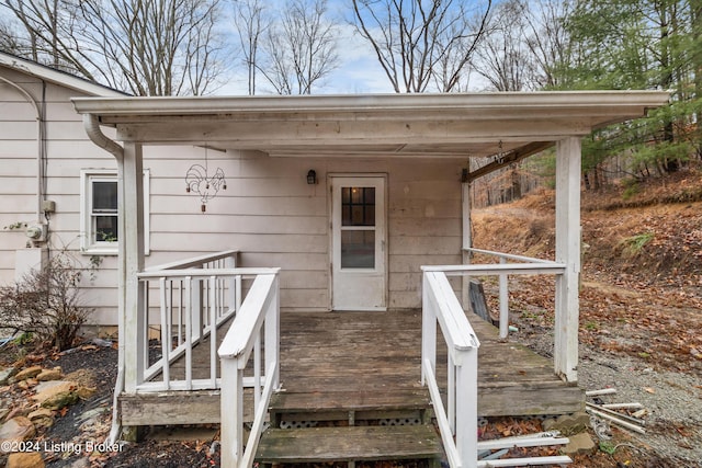 property entrance featuring a wooden deck