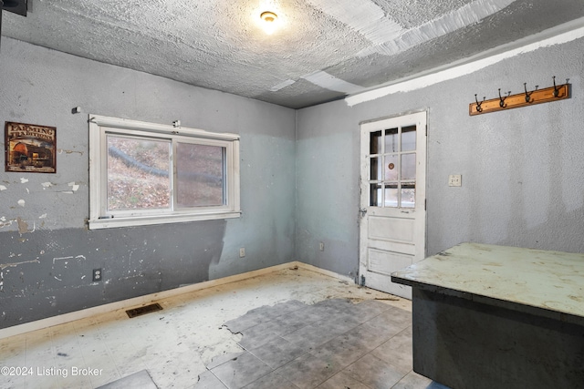 interior space with a textured ceiling