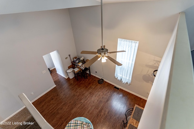 interior space with ceiling fan and hardwood / wood-style floors