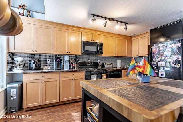 kitchen featuring black appliances, decorative backsplash, dark wood-type flooring, a textured ceiling, and light brown cabinetry