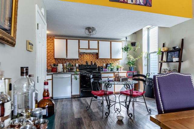 kitchen featuring tasteful backsplash, dark hardwood / wood-style floors, dishwasher, black electric range, and white cabinets