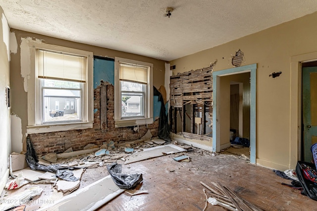 miscellaneous room with a textured ceiling