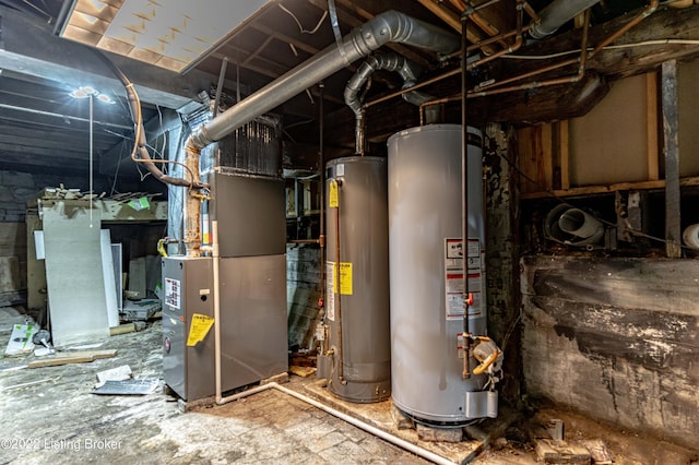 utility room with heating unit and water heater