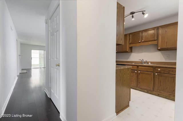 hallway featuring light hardwood / wood-style floors and sink