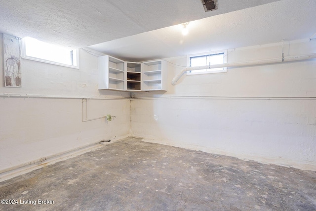 basement with a textured ceiling