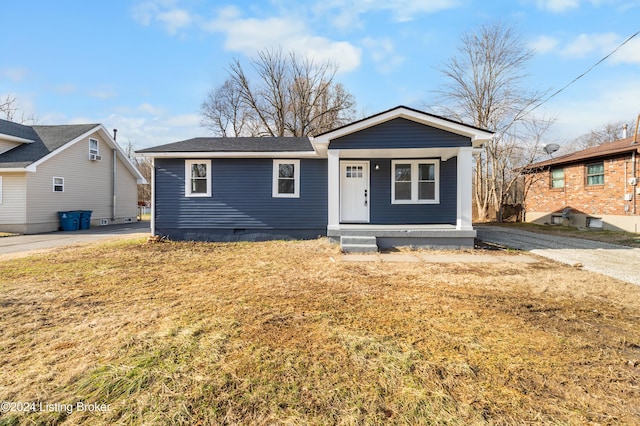 view of front of house featuring a front yard and a porch