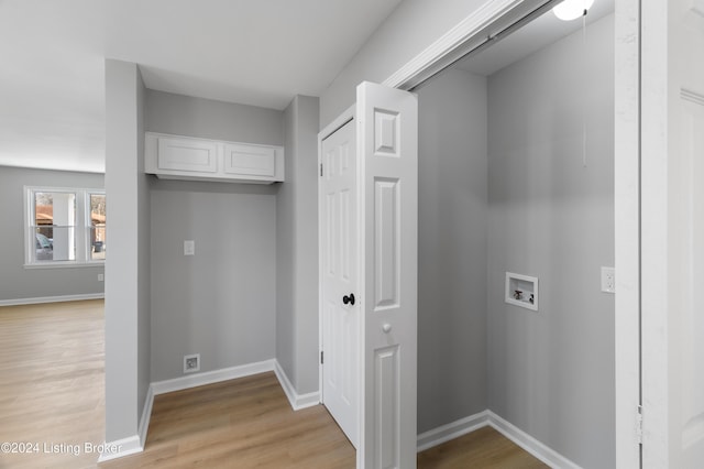 laundry room with washer hookup and light wood-type flooring