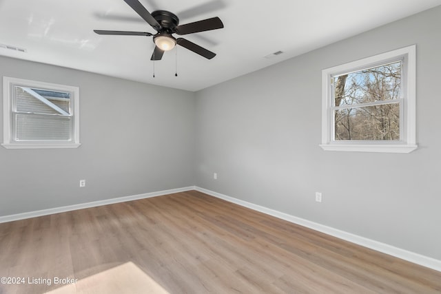 spare room featuring ceiling fan and light hardwood / wood-style floors